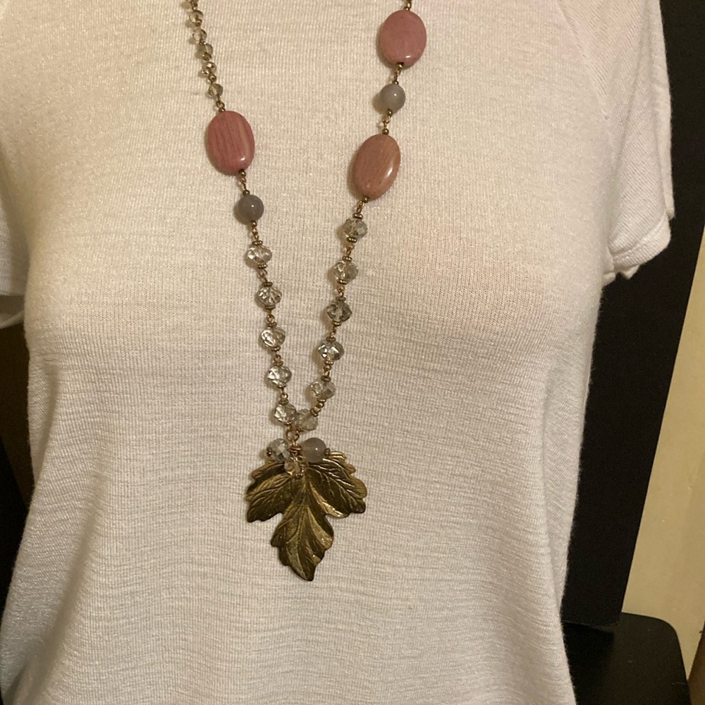 Gold tone leaf pendant necklace with polished pink and gray acrylics